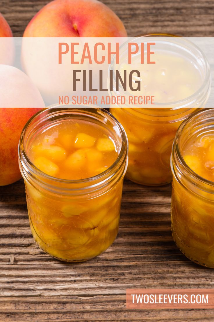 peach pie filling in mason jars with peaches around the edges on a wooden table