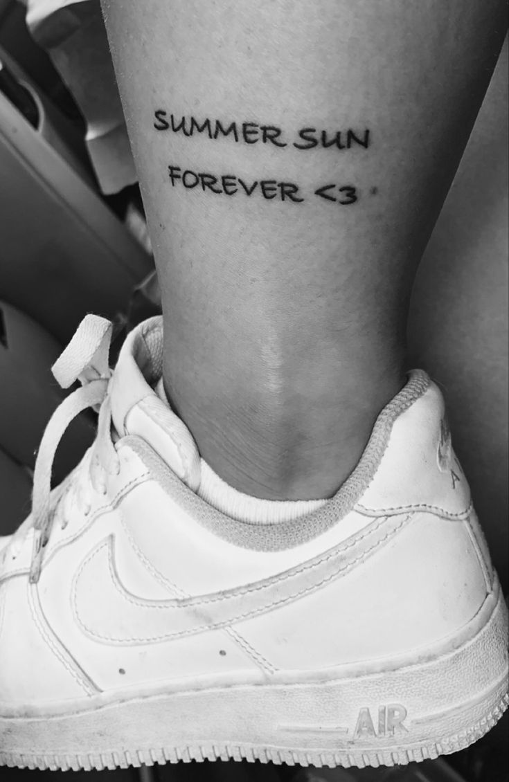 a woman's foot with the words summer sun forever on her left calf tattoo