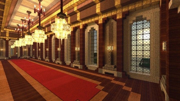 a large room with chandeliers and red rugs on the floor in front of windows