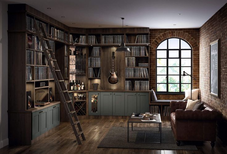 a living room filled with lots of furniture and bookshelves next to a window