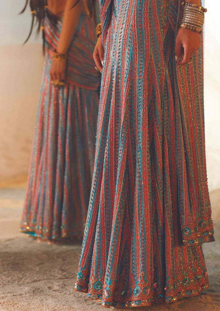 Our aliza sharara sari set is one of a kind attire that speaks of life and color. The vivid details are fascinating along with long trails of multicolored embroidery on shimmer fabric. To make it more special, a drape embodies and completes the attire. A perfect show stealer with style so surreal that it makes you the epitome of elegance and grace. Multicolor Anarkali Palazzo Set With Traditional Drape, Multicolor Floor-length Georgette Palazzo Set, Floor-length Multicolor Georgette Palazzo Set, Multicolor Floor-length Anarkali Palazzo Set, Multicolor Floor-length Palazzo Set With Dupatta, Floor-length Multicolor Embroidered Sharara For Party, Bollywood Style Floor-length Multicolor Palazzo Set, Traditional Drape Multicolor Palazzo Set For Navratri, Multicolor Georgette Palazzo Set With Pallu