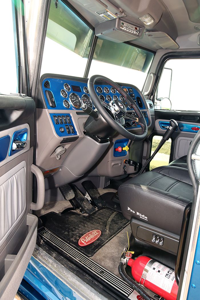 the interior of a truck with blue trim