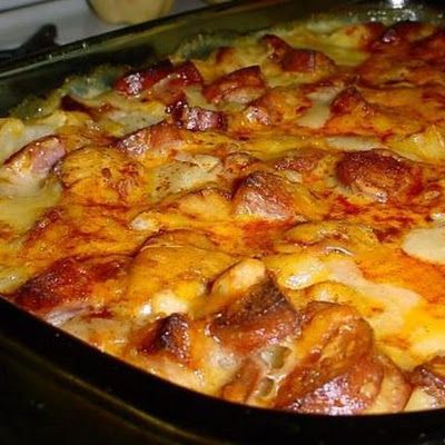 a casserole dish with meat and cheese on it