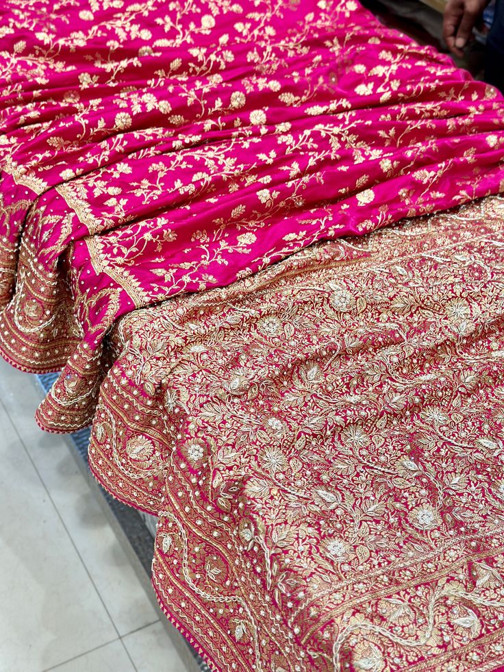 A perfect Rani Pink Banarasi Silk Saree adorn with pearls, stones and zardozi. Luxury Banarasi Silk Embroidered Fabric For Reception, Luxury Silk Thread Saree With Dabka Work, Rani Pink Bridal Saree, Silk Thread Dupatta With Dabka Work For Navratri, Traditional Silk Diwali Wear With Dabka Work, Traditional Wear With Dabka Work For Reception, Reception Traditional Wear With Dabka Work, Festive Silk Thread Sharara With Dabka Work, Silk Thread Dupatta With Dabka Work For Diwali