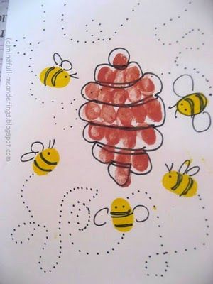 the bees are flying around on the white paper with yellow and red dots in it