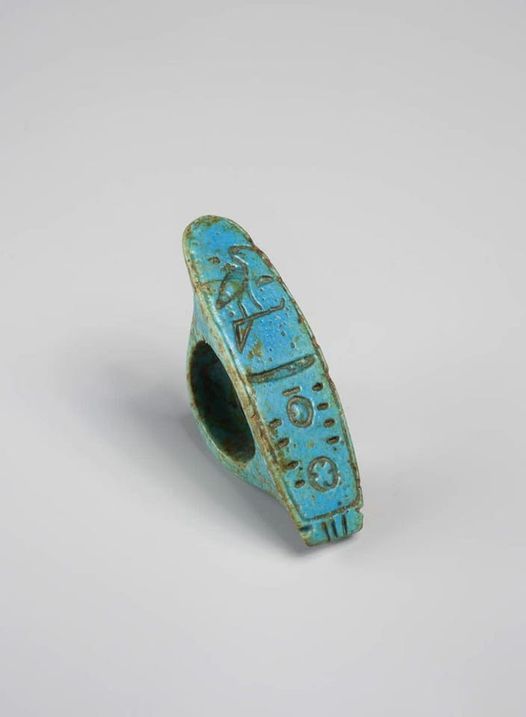 an ancient turquoise ring with writing on it