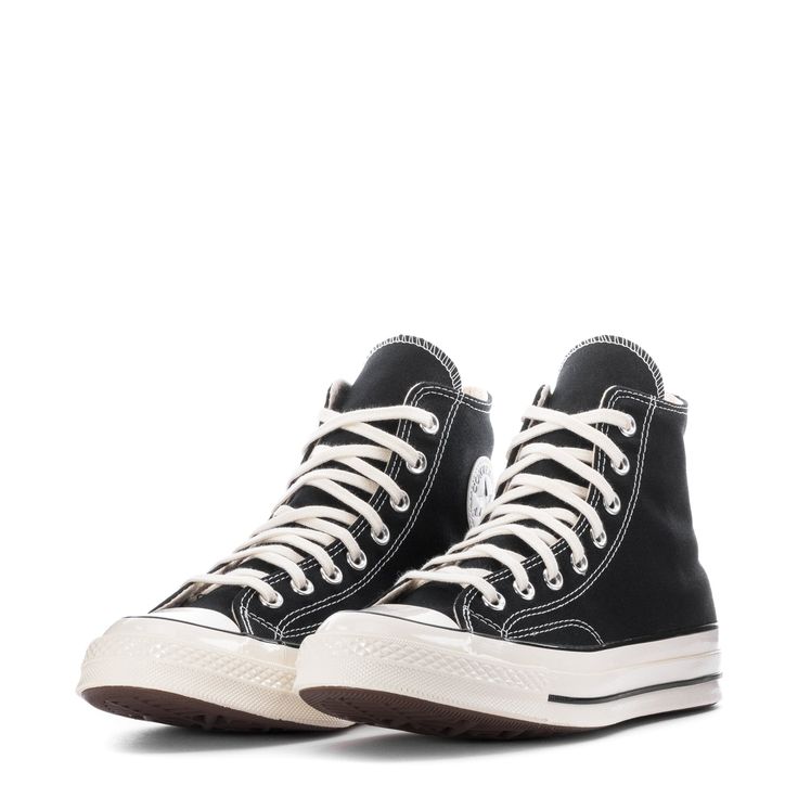 By 1970, the Chuck Taylor All Star evolved into one of the best basketball sneakers ever. The Converse Chuck 70 celebrates that heritage by combining archival-inspired details with modern comfort updates. Ortholite insole cushioning and winged tongue stitching take the comfort level up a notch. A glossy midsole and signature star ankle patch bring out the shoe's iconic, vintage style. Runs a half-size large. High-top shoe with canvas upper. Winged tongue stitching helps lock it in place. Vintage Vintage Basketball Shoes With Boost Midsole For Streetwear, Vintage Basketball Shoes With Boost Midsole And Round Toe, Retro Basketball Shoes With Rubber Sole For Streetwear, Throwback Basketball Shoes With Rubber Sole, Retro High-top Basketball Shoes With Gum Sole, Retro High-top Sneakers With Boost Midsole, Throwback Lace-up Basketball Shoes With Rubber Sole, Retro Black Basketball Shoes With Rubber Sole, Vintage Basketball Shoes With Boost Midsole