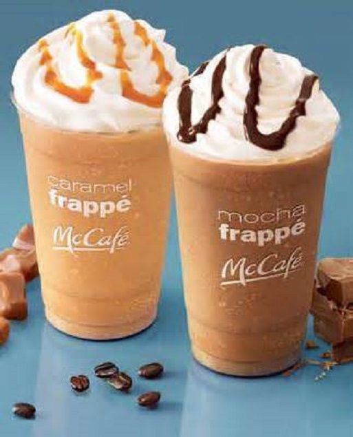 two iced coffees with whipped cream and caramel drizzle