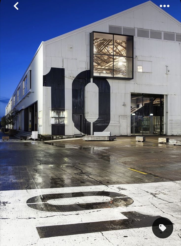 an industrial building with the number ten painted on it