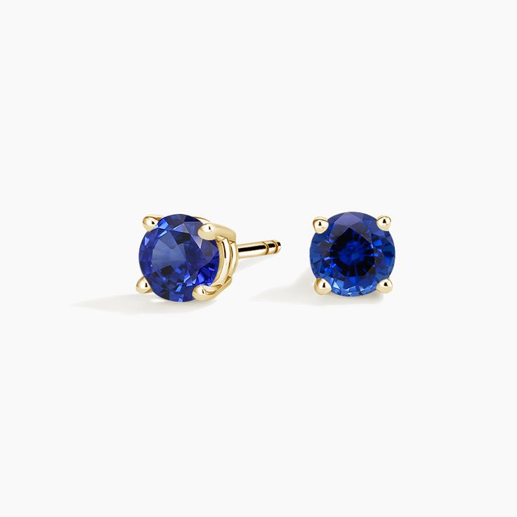 Solitaire Sapphire Stud Ears - 18K Yellow Gold. A beautifully matched pair of brilliant blue sapphires are secured in classic four-prong basket settings with comfortable push back posts for pierced ears. Classic Round Tanzanite Earrings, Tanzanite Earrings With Prong Setting, Classic Blue Lab-created Sapphire Earrings, Classic Blue Sapphire Earrings, Classic Yellow Gold Jewelry With Lab-created Sapphire, Classic Yellow Gold Lab-created Sapphire Jewelry, Brilliant Round Cut Sapphire Earrings, Classic Sapphire Birthstone Earrings, Classic Blue Brilliant Cut Earrings