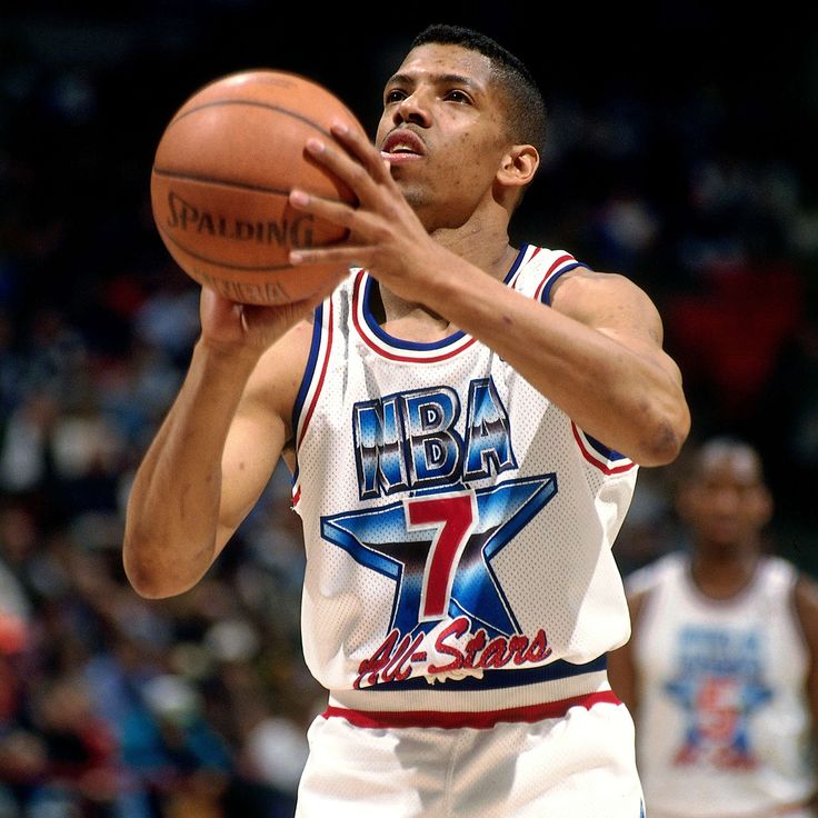 a man holding a basketball in his right hand