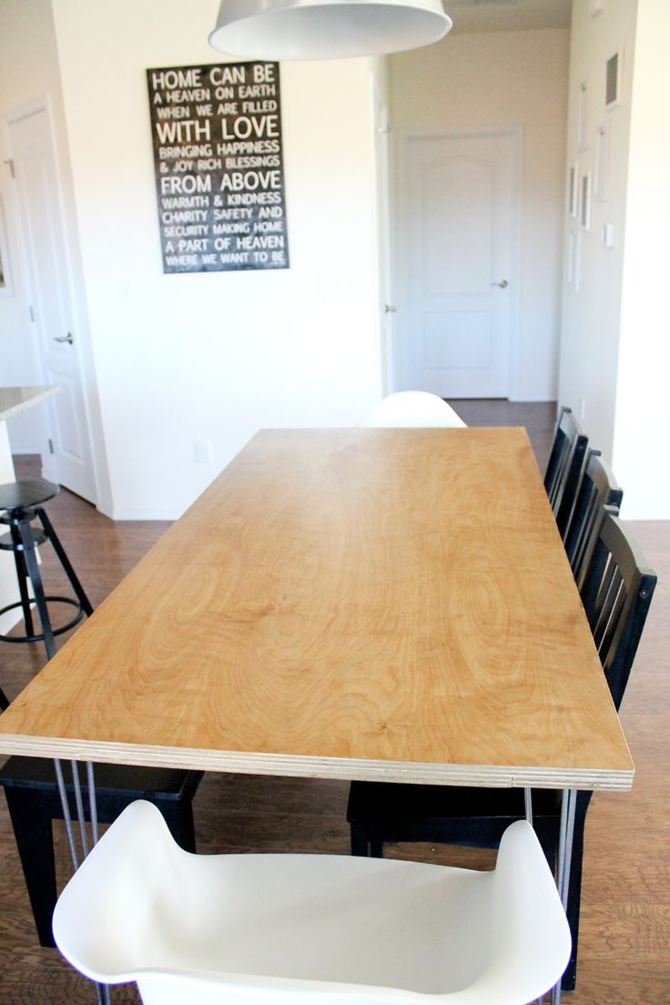 a kitchen table with chairs around it