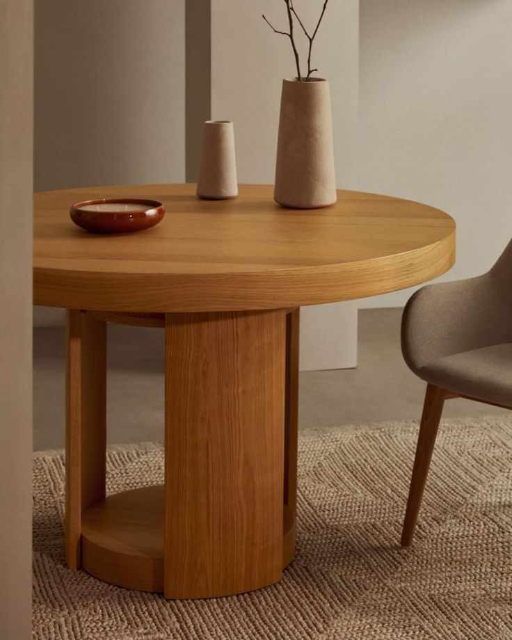 a wooden table with two chairs next to it