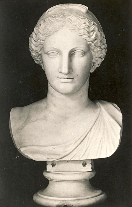 an old photo of a bust of a woman