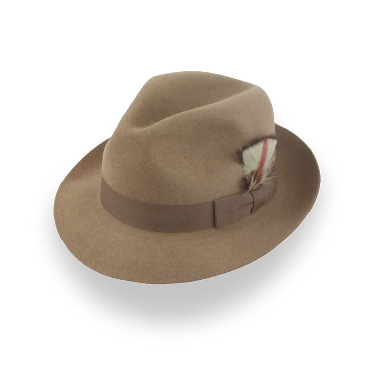 Vintage-Inspired Medium Brim Fedora Discover the charm of a medium brim fedora with our vintage-inspired design. Made from luxurious beaver fur felt, this hat boasts a smooth finish and a classic center-dent crown. The 2 1/8" raw-edge snap brim offers versatility, perfect for jazz nights or casual outings. Customize your look with a dusty camel felt and hickory grosgrain ribbon hatband. The pure viscose satin lining and genuine leather sweatband ensure comfort and durability. This medium brim fedora seamlessly blends style and functionality for any occasion. Outdoor Hut, The Raid, Homburg, Chapeau Cowboy, America Latina, Hat Box, Custom Monogram, Hat Band, Vegetable Tanned Leather