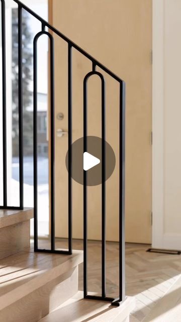 an image of a stair railing with a video play button on the bottom right hand side