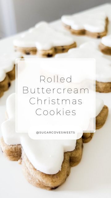 some cookies with white frosting on them and the words rolled buttercream christmas cookies