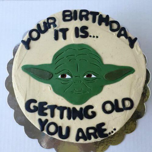 a birthday cake with the words, your it is getting old you are yoda