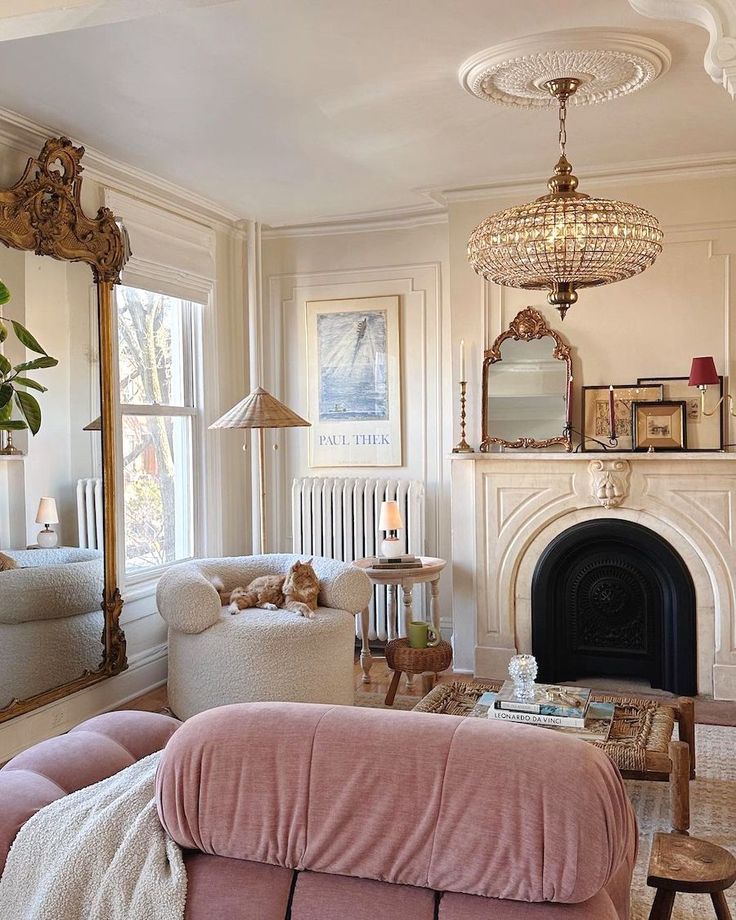 a living room filled with furniture and a christmas tree in the corner near a fire place