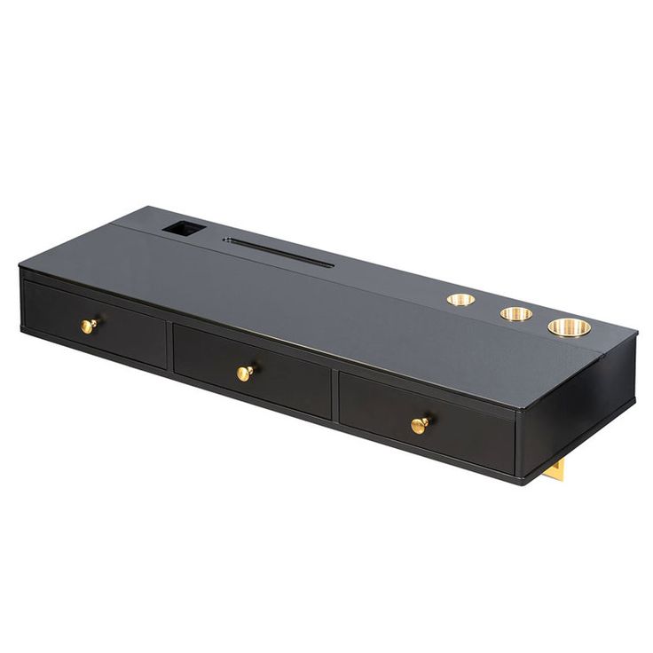 a black box with three drawers and two gold knobs on the bottom, sitting on a white surface