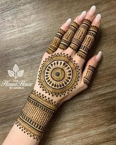 henna tattoo on the palm of a woman's hand