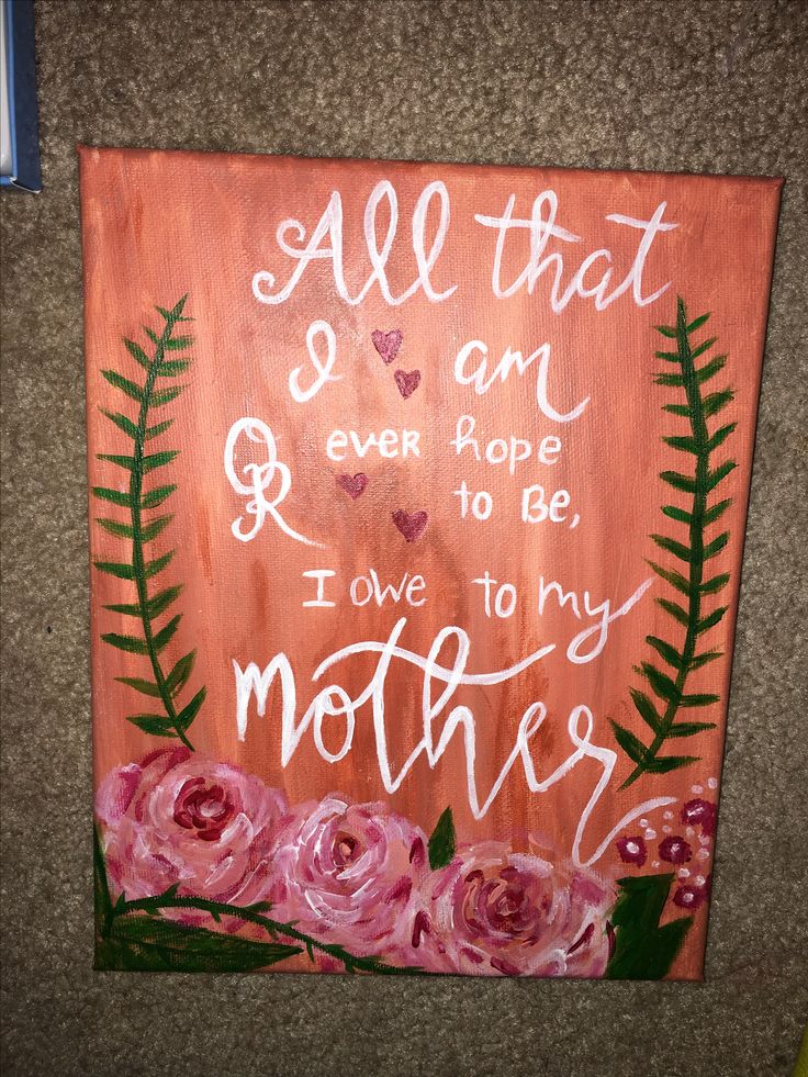 a wooden sign with flowers and leaves on it that says all that i am ever hope to be, i love to my mother