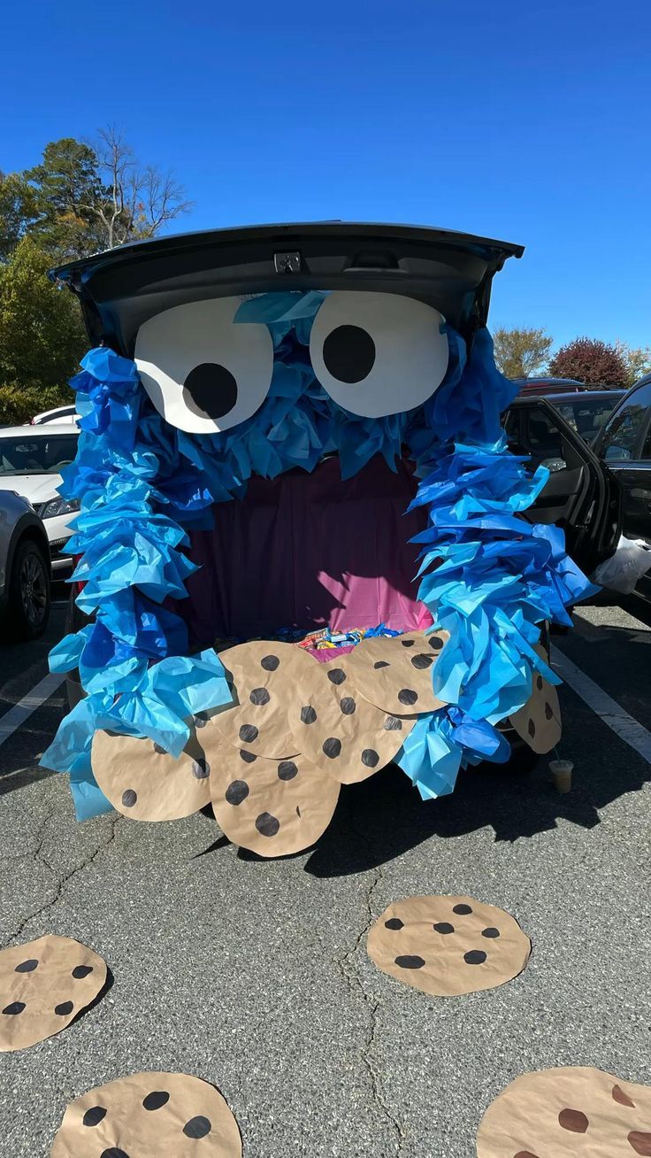 a car decorated with cookie cookies in the shape of a monster