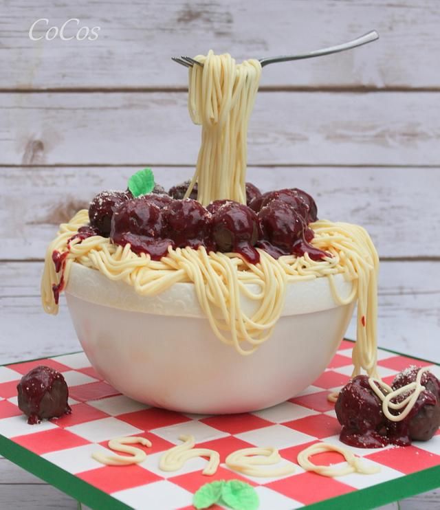 a cake made to look like spaghetti and cherries