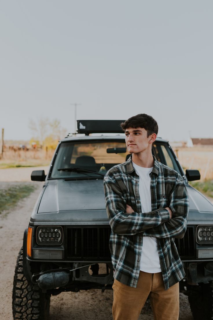 a man standing in front of a truck