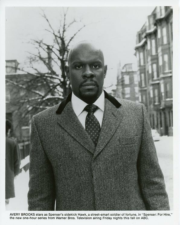 a black and white photo of a man in a suit