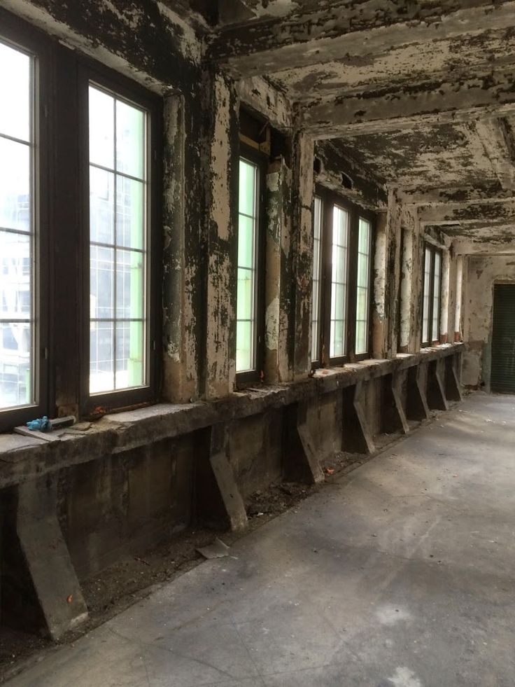 an empty room with several windows in it