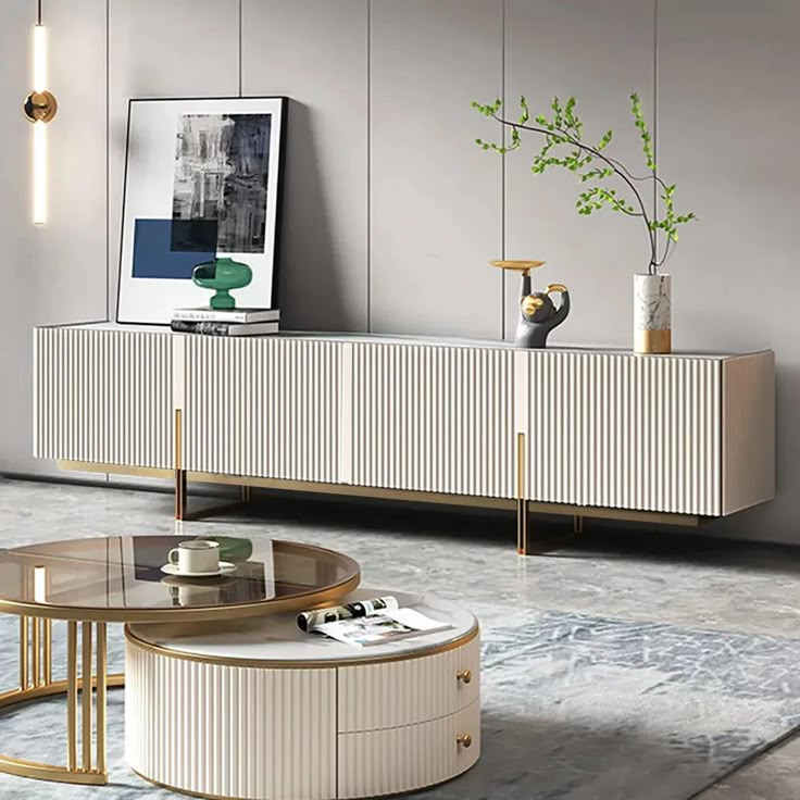 a modern living room with an oval coffee table and sideboard in the middle, along with two vases on either side