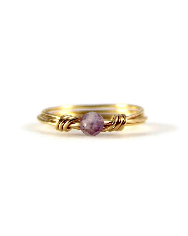 This Purple Amethyst Ring features a wire-wrapped design with a sterling silver or 14K gold filled band, showcasing a dainty faceted gemstone. Available in custom sizes 5 to 16, it's perfect for stacking and makes a beautiful February birthstone piece. This ring is polished for a beautiful handmade high-quality ring.  ✦ ✦ NOTE: The natural amethyst gemstones are displayed as accurately as possible. There may be light variations in color.  This occurs due to the fact they're natural gemstones. 2024 Jewelry, Purple Amethyst Ring, Wrapped Crystal, Wire Ring, Wire Wrapping Crystals, Ring Ideas, Jewelry Wire, Wire Rings, Wire Wrapped Rings