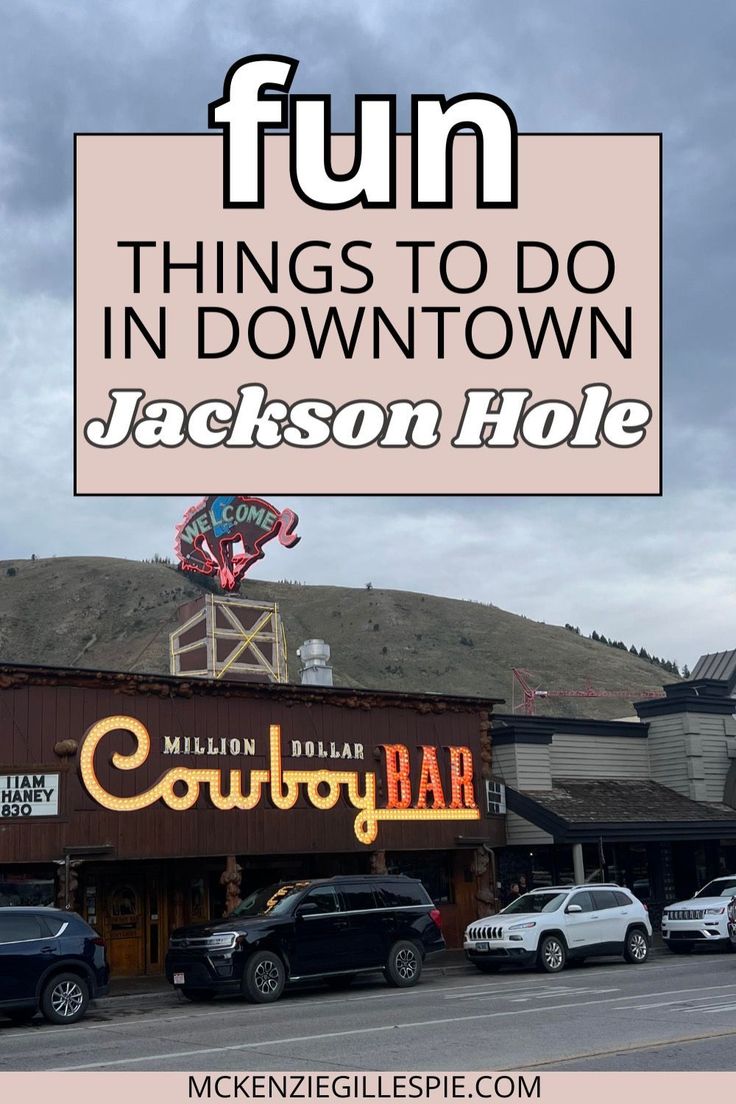 a sign that says fun things to do in downtown jackson hole with cars parked outside