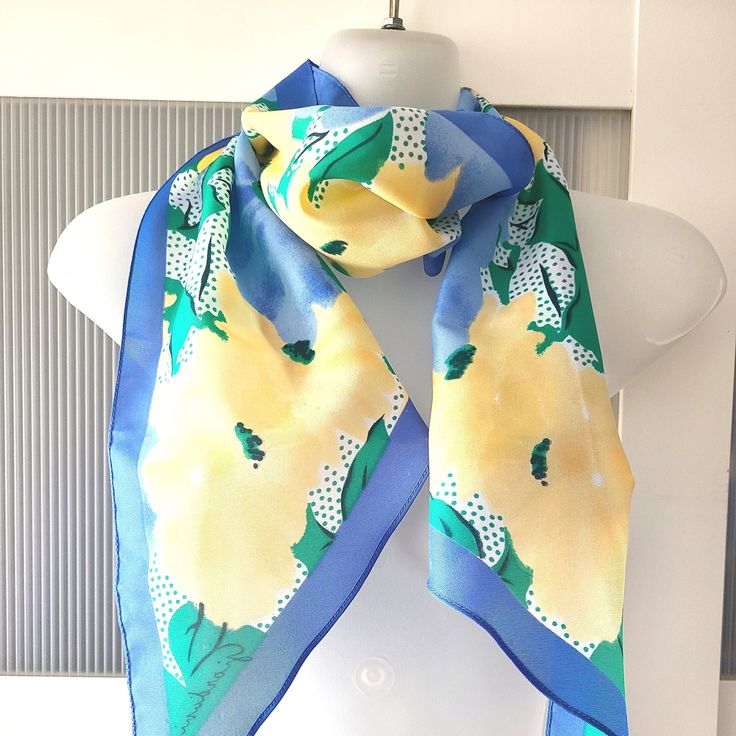 Beautiful and stylish scarf by Giordani, Italy. The scarf is blue with a strking water color floral design featuring yellow flowers. The scarf can be used as a neck wrap, headband, hair tie, bag decor, hat band and even belt. Ir is 100% polyester. The scarf is in excellent condition and will make a beautiful gift! It comes in a gift wrap and with a 'Thank you' card. For more scarves in my store visit: https://www.etsy.com/ca/shop/NostalgicByLiliya?ref=seller-platform-mcnav&section_id=25031148 Fo Blue Silk Scarves For Spring, Blue Silk Scarf For Beach In Spring, Chic Blue Silk Scarf For Spring, Blue Summer Scarves For Vacation, Blue Bohemian Silk Scarf For Spring, Bohemian Blue Silk Scarf For Spring, Blue Silk Casual Scarves, Blue Silk Casual Scarf, Casual Blue Silk Scarves