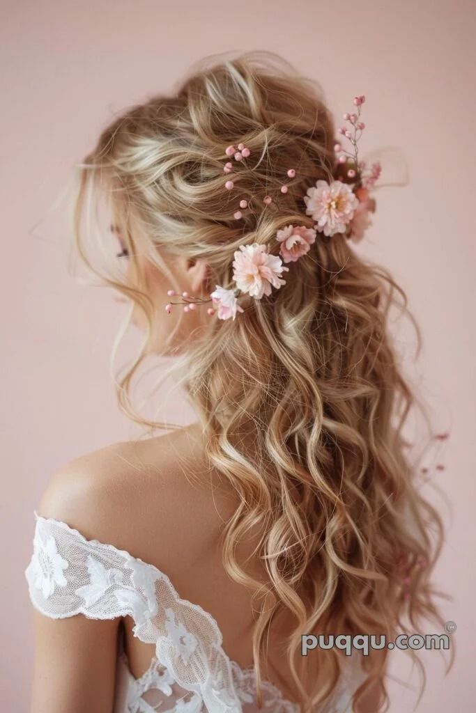 a woman with long blonde hair and flowers in her hair is wearing a white dress