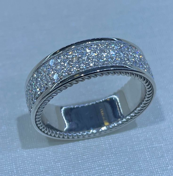 a white gold ring with diamonds on it