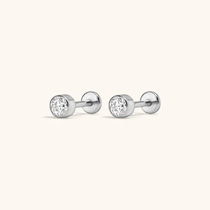 The ultimate anchor for your ear stack. Introducing the Nap Earrings Collection - our signature push pin flat backs designed for 24/7 poke-free wear! Made from medical grade titanium to be safe for sensitive skin. And, for the first time, we made them in 20g (aka the same thickness as traditional earrings), so they’re perfect for lobe piercings! The push pin earring posts are easy to insert and remove from your ear, and the flat back makes them super comfortable to wear. One earring, infinite po Classic White Gold Internally Threaded Cartilage Earrings, Modern Internally Threaded Adjustable Earrings, Modern White Gold Piercings For Everyday, Classic Adjustable Hypoallergenic Cartilage Earrings, Modern Hypoallergenic White Gold Piercings, Modern Adjustable Hypoallergenic Piercings, Classic Hypoallergenic Nose Studs Gift, Everyday Internally Threaded White Gold Piercings, Adjustable Hypoallergenic White Gold Piercings