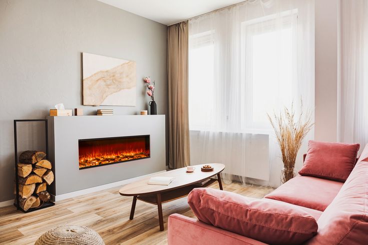 a living room filled with furniture and a fire place in the middle of the room