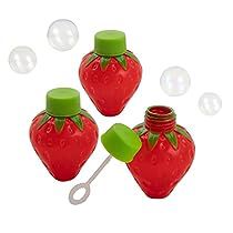 three red plastic strawberry shaped bottles with green caps and spoons in front of bubbles