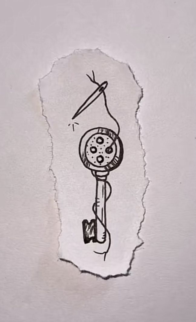 a piece of torn paper with a drawing of a clock on it's side