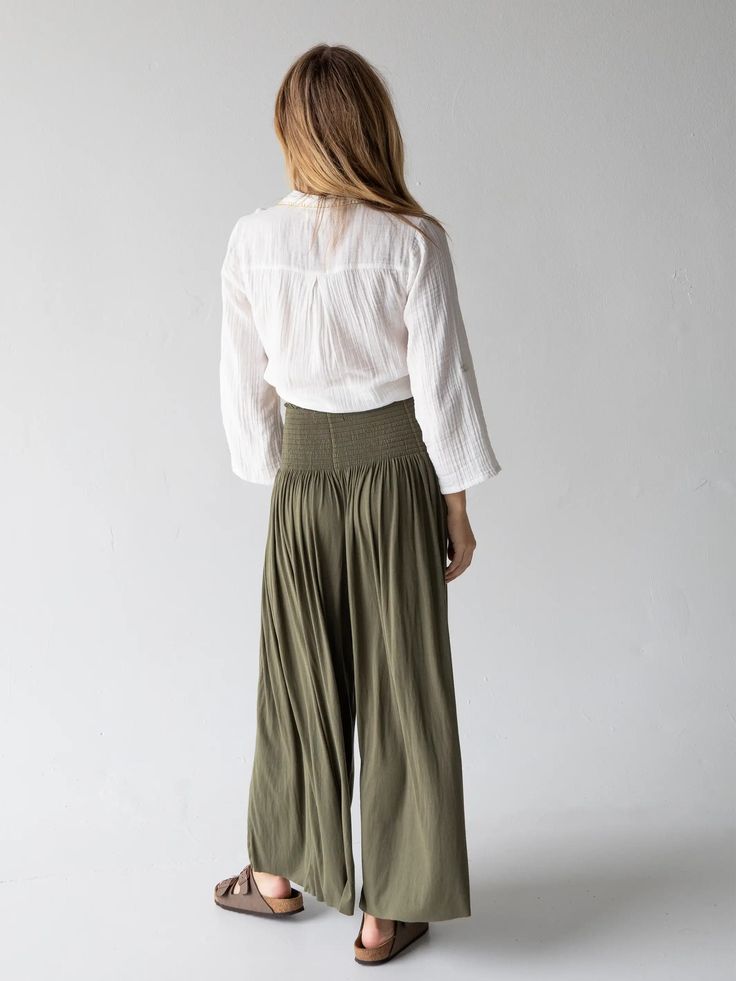 Meet the comfiest pants ever! Our Make A Move Palazzo Pants have a wide leg silhouette, a smocked waistband, and the most flattering fit! The best thing about them is the raw edge hem so you can cut to your own length… they even look great cropped! They’re so cute paired with any of our tanks and tees or can easily be dressed up, making them perfect to wear no matter the occasion! You'll literally want to wear them every day! Versatile Ankle-length Wide Leg Pants, Versatile Wide Leg Pull-on Pants For Loungewear, Chic Wide Leg Pants With Ribbed Waistband For Fall, Fall Wide Leg Pants With Elastic Waistband, Versatile Wide-leg Cargo Pants, Versatile Bottoms With Comfort Waistband For Fall, Versatile Fall Bottoms With Comfort Waistband, Full Length Rayon Pants For Loungewear, Effortless High-waisted Wide Leg Pants With Elastic Waistband