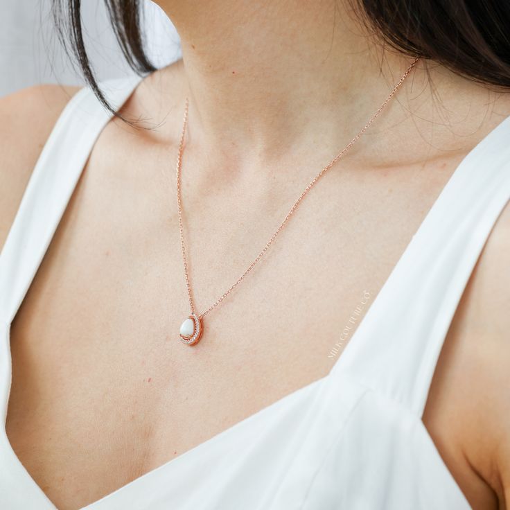 The meaning of "Halo Au Lait" is "Halo with Milk" in French, reflecting the essence of the necklace. The drop-shaped stone is expertly crafted to resemble a drop of milk, capturing the sacrifice of motherhood. Its unique shape also adds deep symbolism to the necklace, reminding us of the life-giving nature of breastmilk. Delicate Oval Pendant Necklace For Her, Delicate Oval Pendant Necklace As Gift For Her, Sterling Silver Teardrop Necklace With Pearl Charm, Dainty Moonstone Teardrop Pendant Necklace, Minimalist Oval Pendant Necklace As Gift For Her, Delicate Teardrop Pearl Pendant Jewelry, Delicate Teardrop Moonstone Necklace, Oval Pendant Necklace With Pearl Charm As Gift, Oval Pendant Necklace With Pearl Charm For Gift