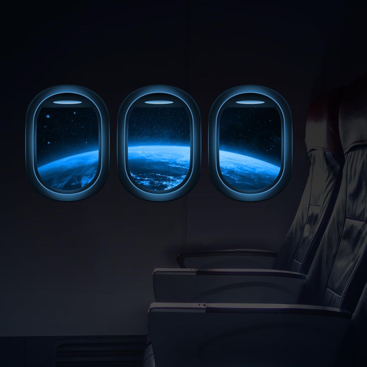 an airplane window with the view of earth from it's seat and another plane wing