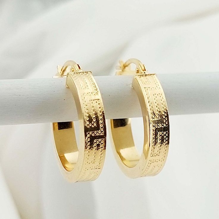 "14K Solid Yellow Gold Hoop Earrings Handmade item Materials: Gold  Diameter : 18mm Thickness : 4mm Style: Mid-century Location: Earlobe Closure: Latch back Crafted in solid 14k Yellow gold and stamped \"14K\" for authenticity This Gorgeous pair of Greek Key Hoop Earrings are a popular choice. 14k gold does not oxidize or discolor, so you can wear your jewelry every day, anywhere! However, to help it look its best, it's a good idea to remove your parts before sleeping and when applying cosmetics Gold Small Hoop Huggie Earrings Stamped 14k, Gold 14k Stamped Small Hoop Huggie Earrings, Small Hoop Huggie Earrings Stamped 14k For Gift, Stamped 14k Small Hoop Huggie Earrings For Gift, 14k Stamped Hoop Huggie Earrings For Gift, Gift 14k Stamped Hoop Huggie Earrings, 14k Gold Huggie Hoop Earrings Gift, 14k Stamped Huggie Hoop Earrings As Gift, Small Hoop Earrings In Stamped 14k Gold