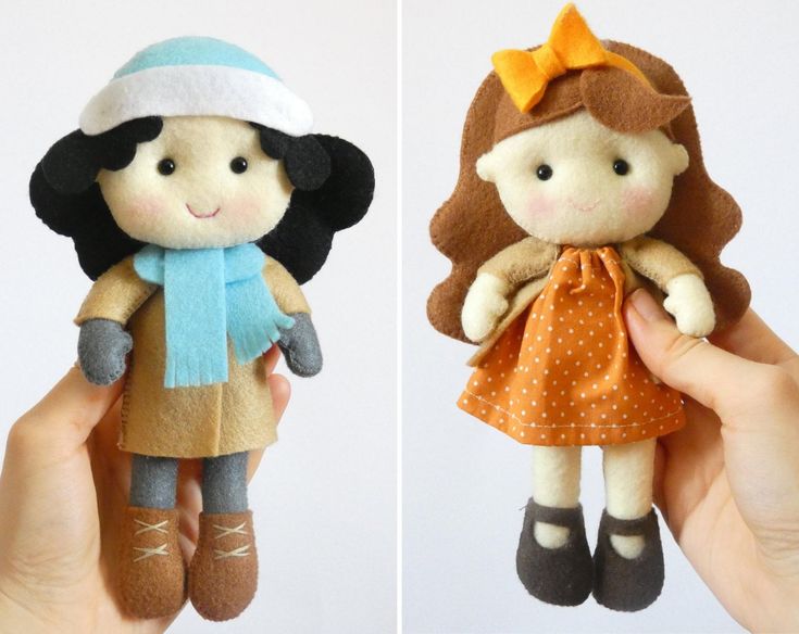 two handmade dolls, one wearing a dress and the other with a hat on