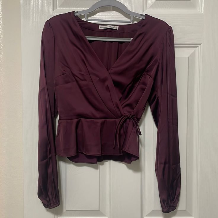 Never Worn Satin Tie Waist Blouse From Abercrombie Long Sleeves Hook Closure At Neckline Chic Burgundy V-neck Blouse, Chic Burgundy Tops For Spring, Burgundy V-neck Top For Date Night, Chic Long Sleeve Burgundy Blouse, Chic Burgundy Long Sleeve Blouse, Burgundy Long Sleeve Tops For Night Out, Chic Burgundy Blouse For Night Out, Burgundy Blouse For Fall Night Out, Chic Burgundy Tops For Workwear