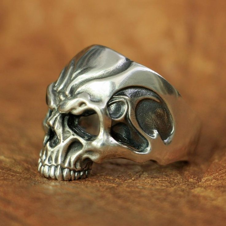 "It's a hard way to the top if you wanna rock and roll" ac/dc ! this silver skull ring will take you to the top, my friend! Are you a fan of rock? Like to listen or play to rock? Then these sterling silver rock rings is made for you. With this masterpiece on your finger, you can be sure that you will feel the power and the spirit of the greatest rockers ever through your veins. As you may have noticed, this skeleton head is well detailed with beautiful engravings all over the forehead, the sharp Edgy Silver Skull Ring As Gift, Edgy Silver Skull Ring For Gift, Edgy Silver Rings For Streetwear, Adjustable Gothic Skull Ring Collectible, Punk Sterling Silver Skull Ring, Sterling Silver Skull Ring In Punk Style, Silver Punk Skull Ring For Halloween, Adjustable Silver Skull Ring Punk Style, Adjustable Silver Skull Ring In Punk Style