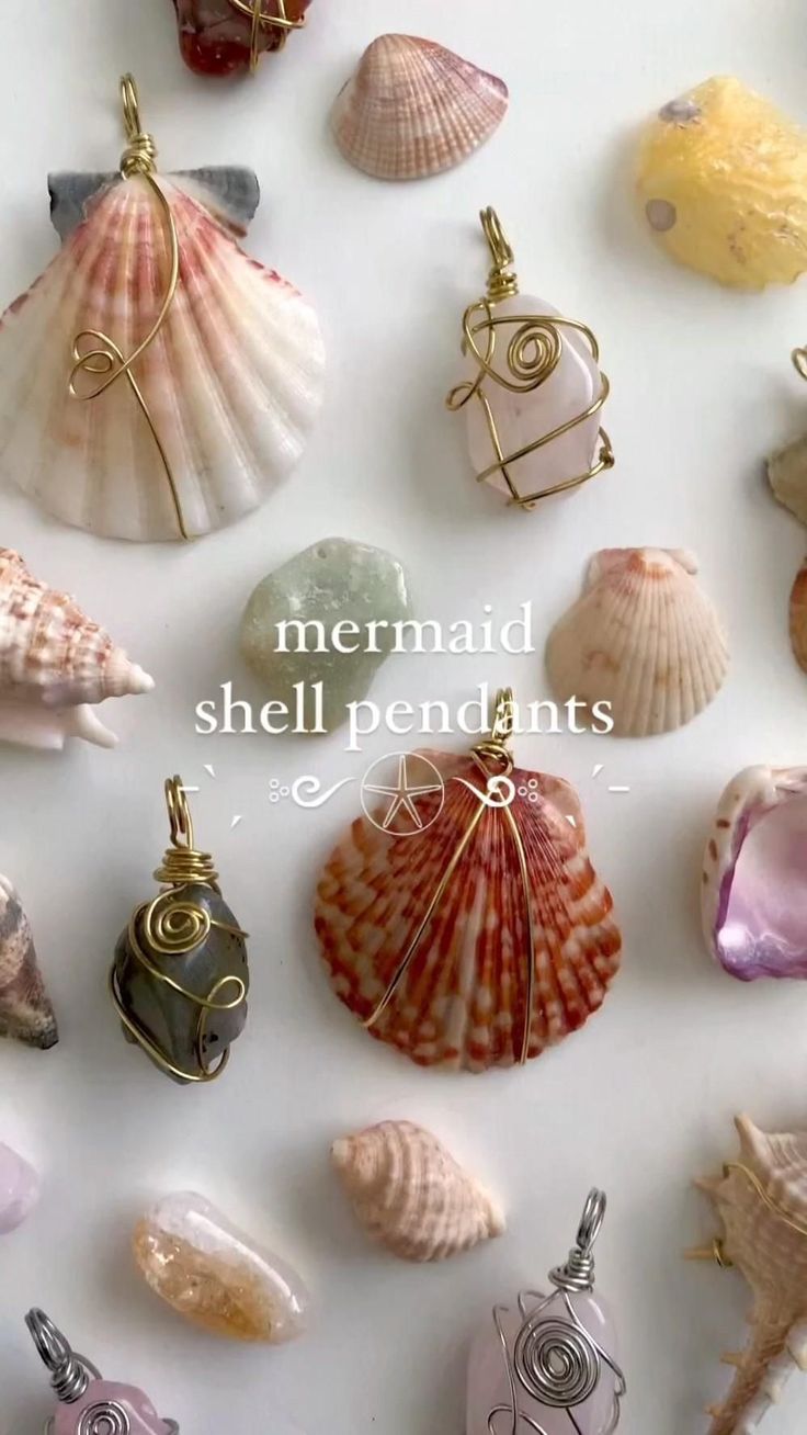 there are many different sea shells on the white surface with words mermaid shell pendants