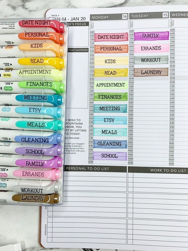 a planner with markers and pens on it next to some other items that are labeled in different colors